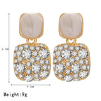 Boucles d'oreilles pendantes géométriques vintage en cristal violet pour femme – Boucles d'oreilles pendantes brillantes et originales | ELARIAH