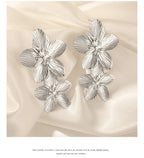 Boucles d'oreilles à tige Unift vintage en forme de fleur pour femme – Bijou bohème tendance en acier inoxydable plaqué or 14 carats