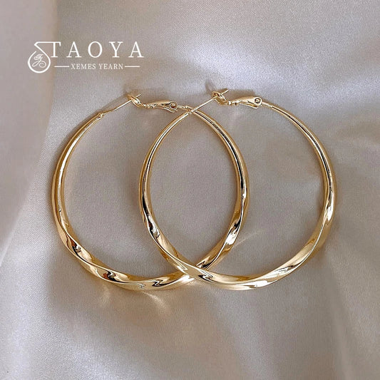 Mobius Twist Gold Hoop Earrings – Classic 50mm Statement Hoops for Women