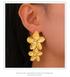 Boucles d'oreilles à tige Unift vintage en forme de fleur pour femme – Bijou bohème tendance en acier inoxydable plaqué or 14 carats