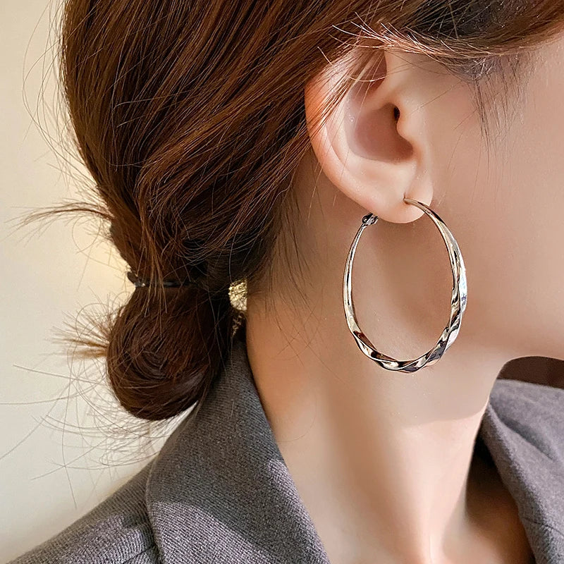 Mobius Twist Gold Hoop Earrings – Classic 50mm Statement Hoops for Women