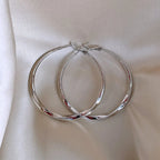 Mobius Twist Gold Hoop Earrings – Classic 50mm Statement Hoops for Women