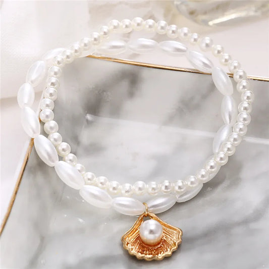 Elegant boho anklet with pearls and shell charm – perfect for beach, weddings, and everyday style.